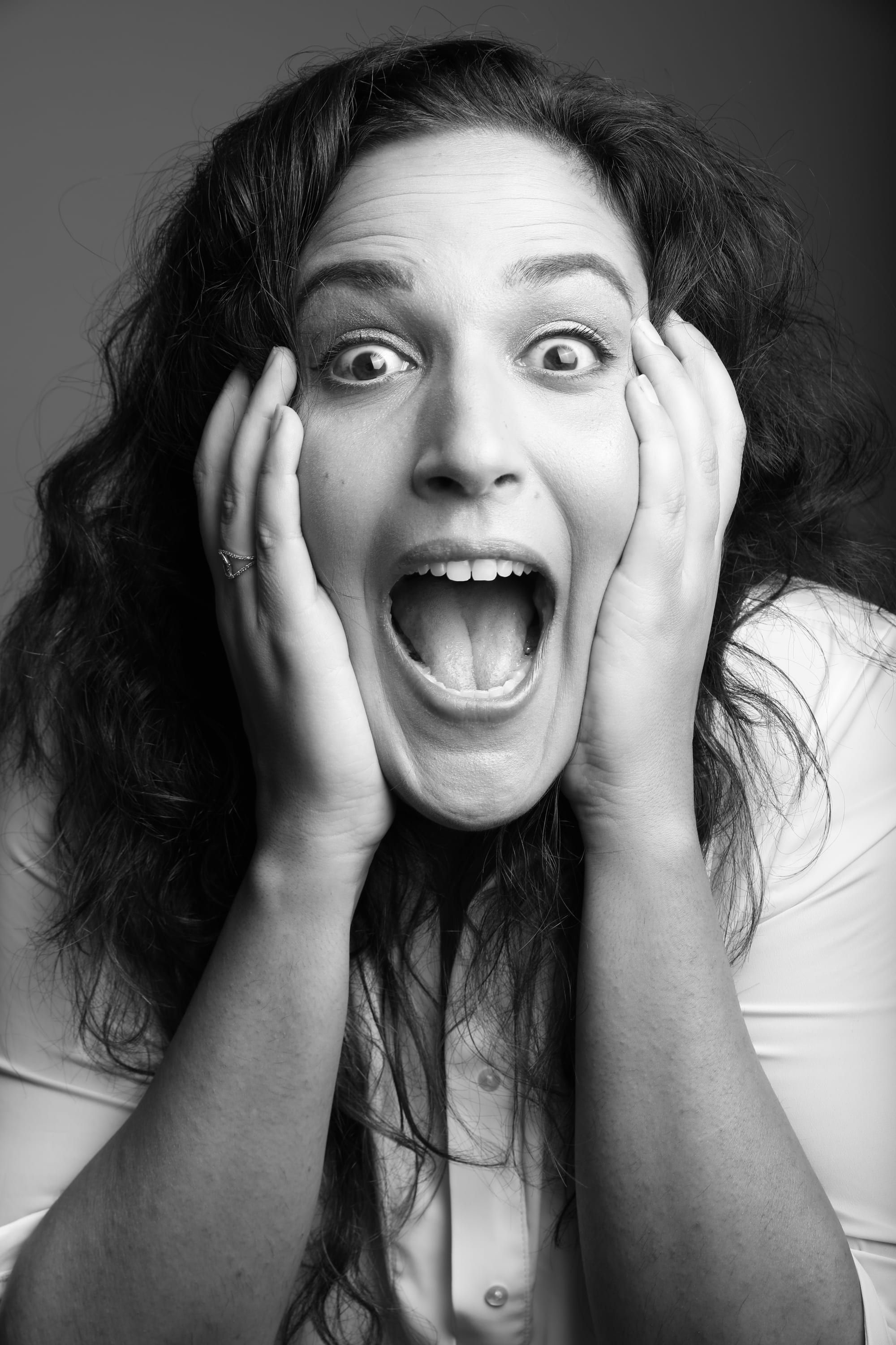 Noam Shuster-Eliassi, hands on her cheeks, mouth open in mock horror