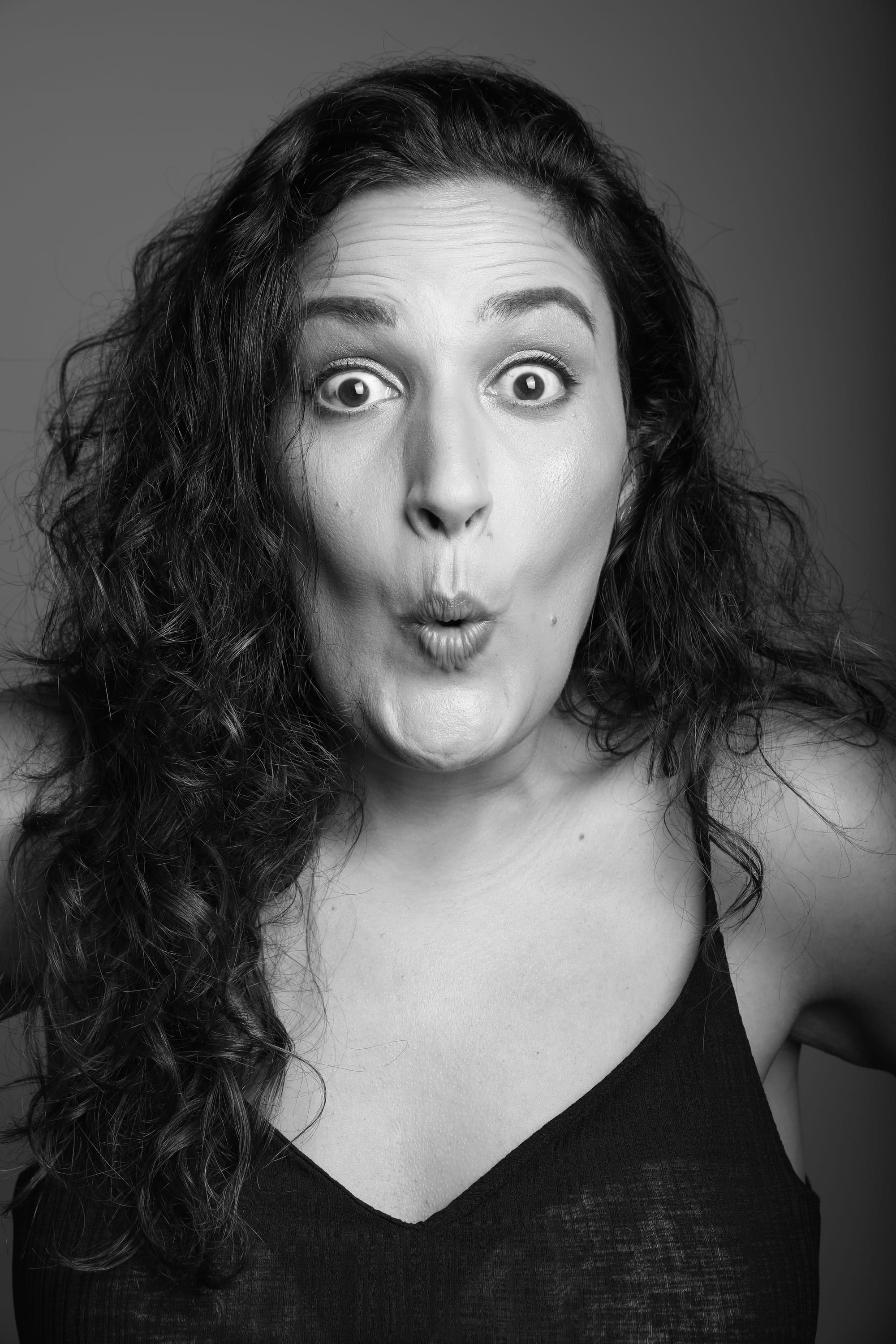 Noam Shuster-Eliassi wide-eyed, lips pursed in exaggerated surprise